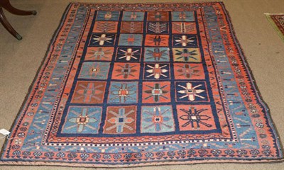 Lot 1105 - Bakhtiari Rug West Iran, circa 1940 The polychrome compartmentalised field enclosed by mid...