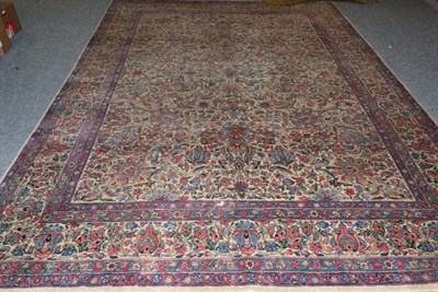 Lot 1110 - Kirman Carpet South East Iran, 20th century The ivory field with an allover design of...