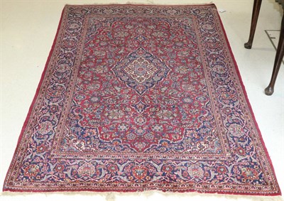 Lot 1111 - Kashan Rug Central Iran, 20th century The raspberry field of vines around an indigo medallion...