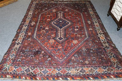 Lot 1113 - Khamseh Carpet South West Iran, circa 1930 The chestnut lozenge field flanked by zoomorphic devices