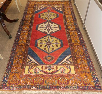 Lot 1114 - Konya Rug Central West Anatolia, circa 1960 The madder lozenge field with three hexagons...