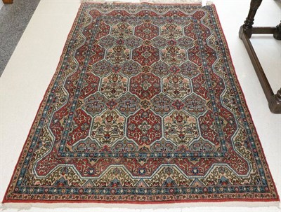 Lot 1115 - Ghom Rug Central Iran, circa 1950 The polychrome compartmentalised field enclosed by reciprocal...