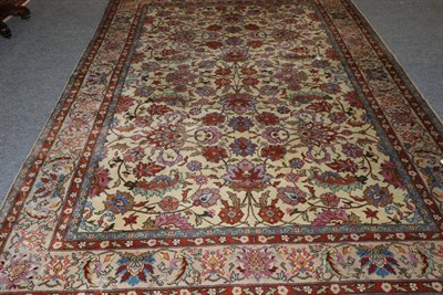 Lot 1126 - Tabriz Design Carpet, circa 1960 The pale corn field with an allover design of palmettes and...