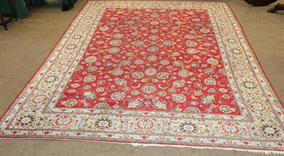 Lot 1129 - Kashan Carpet Central Iran, circa 1950 The raspberry field with an allover design of palmettes...