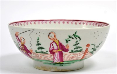 Lot 21 - A Baddeley-Littler Porcelain Bowl, circa 1780, painted with chinoiserie figures in a fenced garden