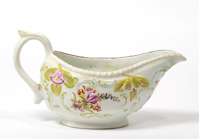 Lot 22 - A Derby Porcelain Sauce Boat, circa 1760, painted with flowersprays within moulded and painted leaf
