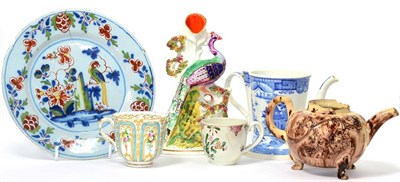 Lot 30 - A Whieldon Type Creamware Teapot, circa 1760, with splashed tortoiseshell glazes, on three...