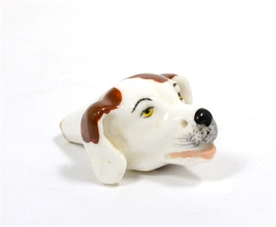 Lot 49 - An English Porcelain Whistle, circa 1830, in the form of a dog's head with brown markings, 5cm long