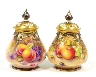 Lot 87 - A Pair of Royal Worcester Porcelain Pot Pourri Vases and Pierced Covers, 20th century, painted by N