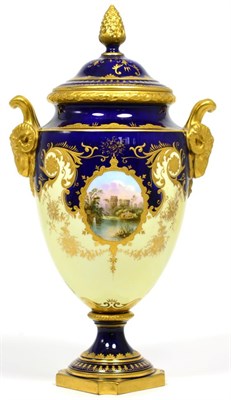 Lot 104 - A Coalport Porcelain Urn Shaped Vase and Cover, circa 1910, with ram's mask and loop handles,...