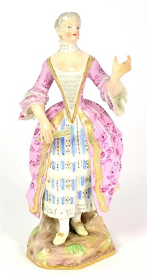 Lot 115 - A Meissen Porcelain Figure of a Lady, late 19th century, standing wearing a lace trimmed dress...