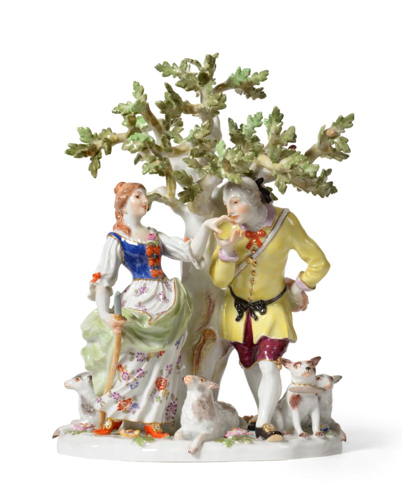 Lot 117 - A Meissen Porcelain Figure Group, circa 1977, as a huntsman and shepherdess before a tree, a...