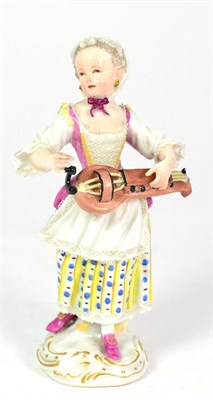 Lot 118 - An Academic Period Meissen Porcelain Figure of a Hurdy-Gurdy Player, circa 1765, standing wearing a