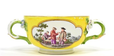 Lot 122 - A Meissen Porcelain Twin-Handled Ecuelle, circa 1750, painted with figures in landscape on a yellow