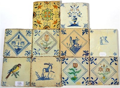 Lot 125 - A Matched Set of Three Delft Tiles, 17th century, painted in blue, green and ochre with...