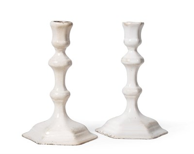 Lot 129 - A Matched Pair of Delft Candlesticks, 1st half 18th century, of hexagonal baluster form, on...