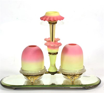 Lot 147 - An S Clarke Burmese and Clear Glass Fairy Light, circa 1890, as three spill vases flanked by...