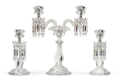 Lot 153 - A Baccarat Glass Three Piece Garniture, 20th century, with lobed sconces hung with prismatic...