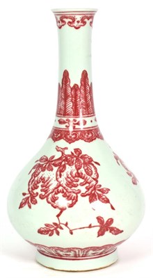 Lot 171 - A Chinese Porcelain Bottle Vase, painted in underglaze red with finger citron and pomegranates...