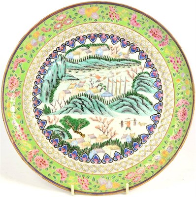 Lot 173 - A Chinese Porcelain Plate, 19th century, painted in famille rose enamels with figures and buildings