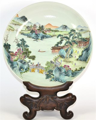 Lot 187 - A Chinese Porcelain Saucer Dish, Qianlong reign mark but not of the period, painted in famille rose