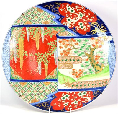 Lot 201 - An Imari Porcelain Charger, Meiji period, typically decorated with a scroll shaped panel of...