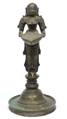 Lot 208 - A South East Asian Bronze Votive Figure, in 17th century style, as a standing female attendant...