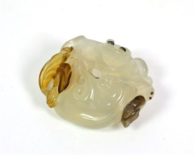 Lot 224 - A Chinese Jade Carving, late 19th/20th century, worked with monkeys amongst fruiting branches,...