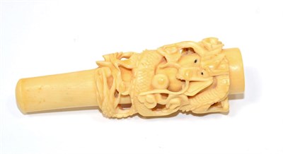 Lot 236 - A Chinese Carved Ivory Cigar Holder, late Qing Dynasty, carved with a dragon amongst scrolls, 9.5cm