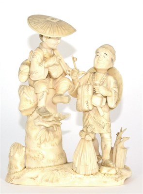 Lot 243 - A Japanese Ivory Okimono, Meiji period, as a boy sitting on a rock smoking a pipe, a man with a...