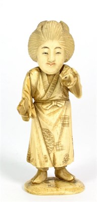 Lot 250 - A Japanese Ivory Okimono, Meiji period, as a geisha holding a fan and frog, 11cm high