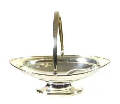 Lot 301 - A Silver Swing-Handled Navette Shaped Basket, Atkin Brothers, Sheffield 1919, on oval pedestal...