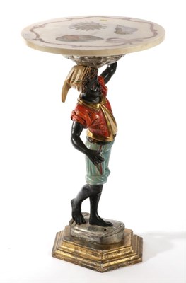 Lot 391 - A Polychrome Wood Figure of a Blackamoor, in 17th century Venetian style, standing wearing red...