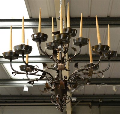 Lot 408 - An Impressive Brown Patinated Twelve-Branch Chandelier, early 20th century, with scrolled arm...