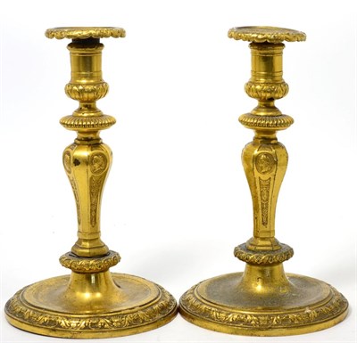 Lot 449 - A Pair of Bronze Candlesticks, in Louis XIV style, of knopped baluster form cast with classical...