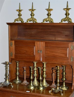 Lot 475 - A Set of Four Brass Pricket Candlesticks, in Renaissance style, on tricorn bases, 23.5cm high;...