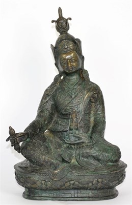 Lot 503 - A Tibetan Bronze Figure of Buddha, in 17th century style, seated holding precious objects on an...