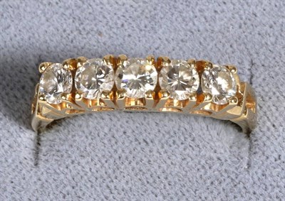 Lot 588 - A Diamond Half Hoop Ring, five round brilliant cut diamonds in claw settings, to pierced shoulders