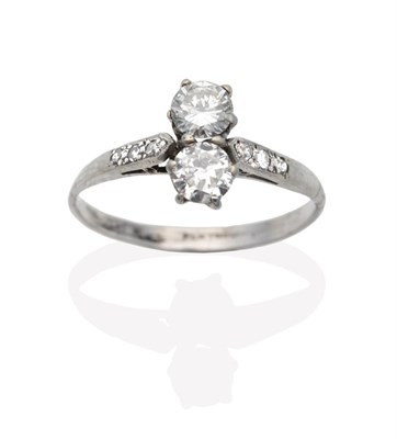 Lot 599 - A Diamond Two Stone Ring, vertically set round brilliant cut diamonds in claw settings, to...