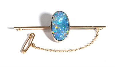 Lot 611 - A Boulder Opal Bar Brooch, an oval cabochon boulder opal in a milgrain setting, to a knife edge...