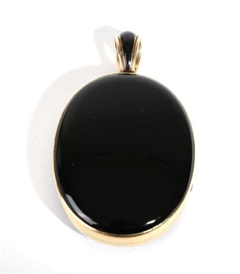 Lot 612 - A Victorian Onyx and Black Enamel Mourning Locket Pendant, each half inset with an oval onyx...