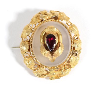 Lot 615 - A Victorian Garnet and Chalcedony Brooch, a pear cut garnet in a collet setting within a...