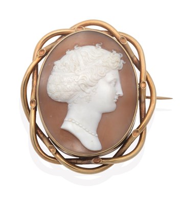 Lot 620 - A Carved Shell Cameo Brooch, depicting the bust of a classical lady, wearing pendant earrings and a