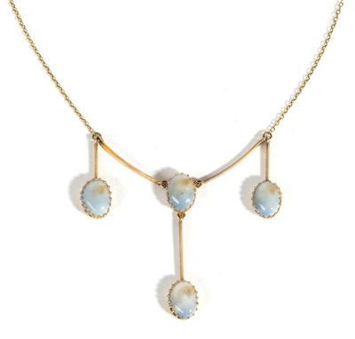 Lot 627 - An Edwardian Shell Necklace, a blue shell in a claw setting suspends a second shell from a...