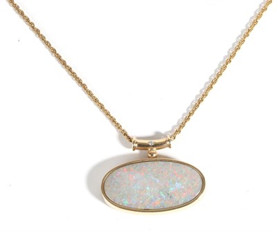 Lot 628 - A 9 Carat Gold Opal and Diamond Pendant, an oval cabochon opal in a rubbed over setting, to a...