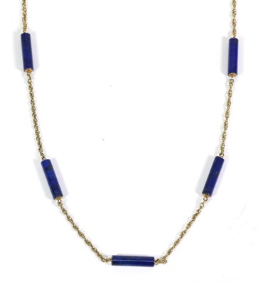 Lot 632 - A Lapis Lazuli Necklace, a Prince of Wales chain with five cylinder-shaped lapis lazuli links...