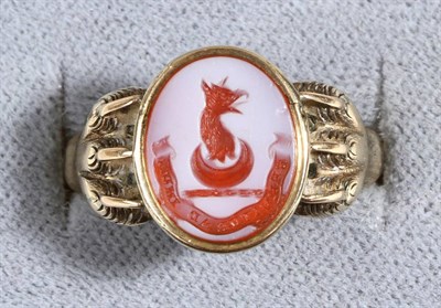 Lot 637 - A Sardonyx Intaglio Signet Ring, an oval white and red sardonyx intaglio seal in a rubbed over...