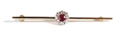 Lot 645 - A Ruby and Diamond Bar Brooch, a round cut ruby within a border of old cut diamonds, to a knife...