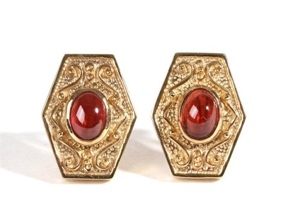 Lot 648 - A Pair of Garnet Earrings, an oval cabochon garnet in a rubbed over setting to an elongated...