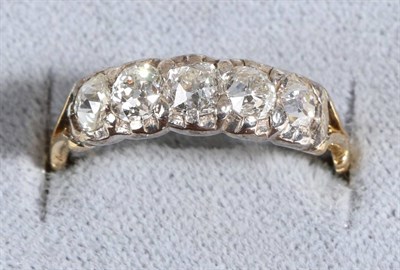 Lot 650 - An 18 Carat Gold Diamond Five Stone Ring, graduated old cut diamonds in collet settings, to...